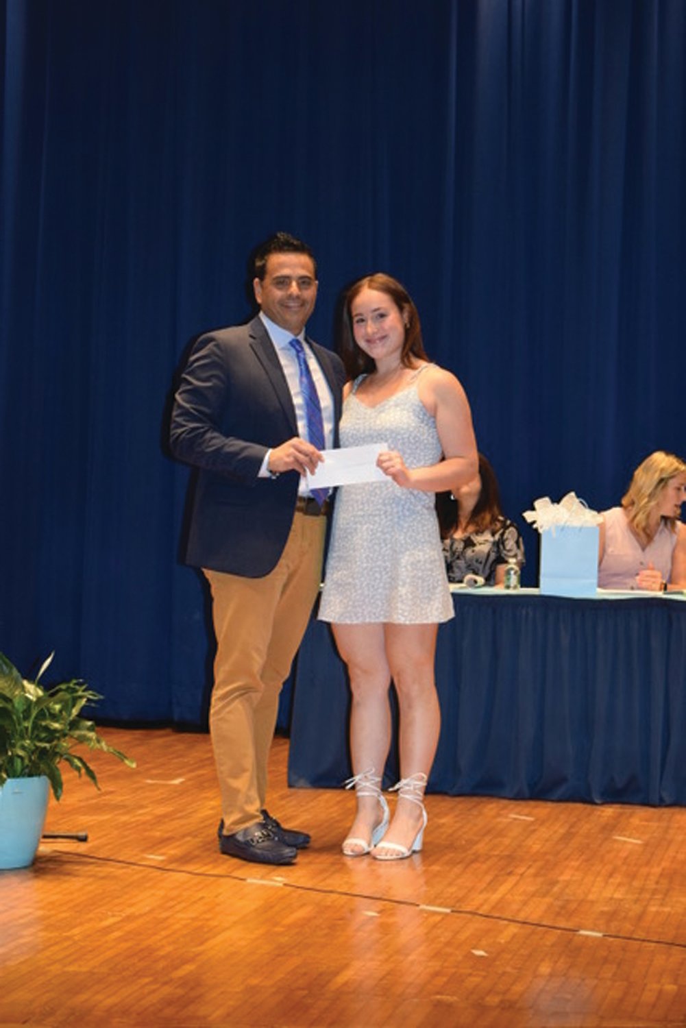 RUSSO MEMORIAL: Johnston Town Council President Robert V. Russo presents the Dr. and Mrs. Vito Russo Memorial Scholarship to Janet Clements during last week’s Senior Honor Awards Night.